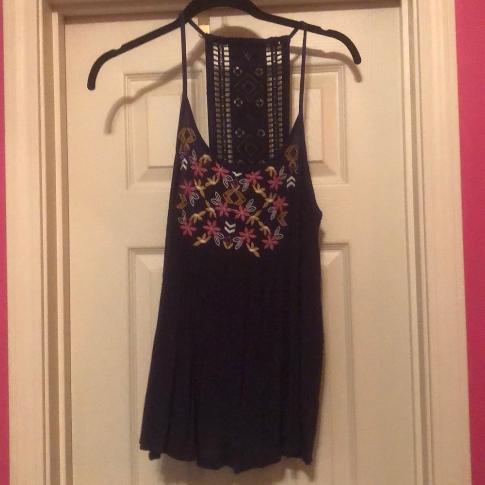 A navy tank top with embroidery flowers.